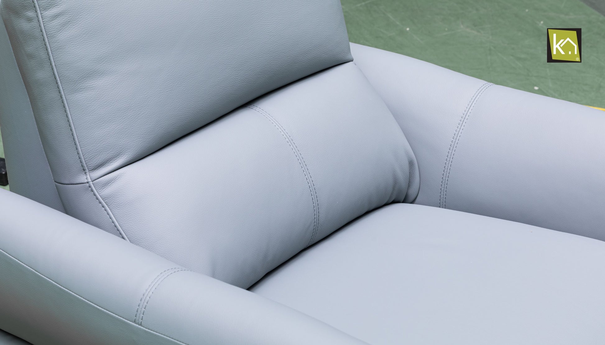 stitching detail on light blue leather upholstery